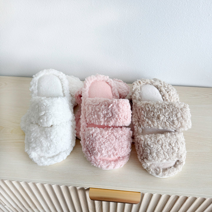 Soft plush house slippers in three pastel colors