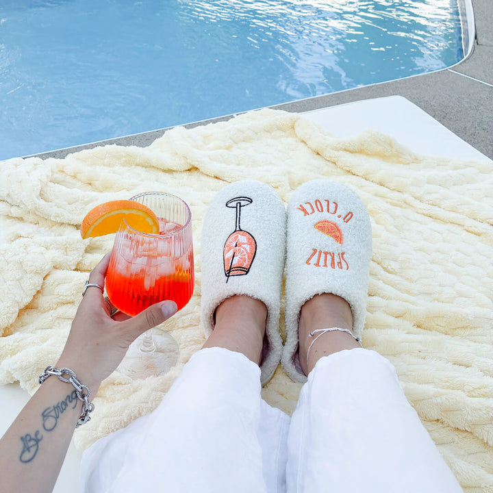 White fuzzy slippers with embroidered cocktail artwork