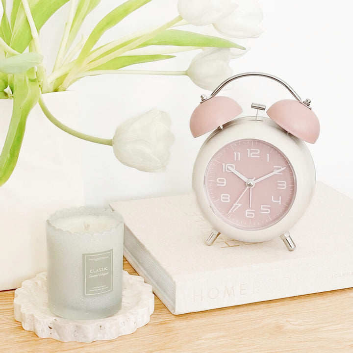 Retro alarm clock with pink dial and cream frame