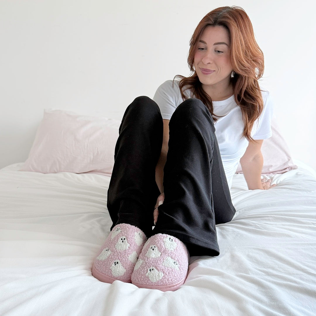 Cozy pink fluffy slippers with playful ghost details