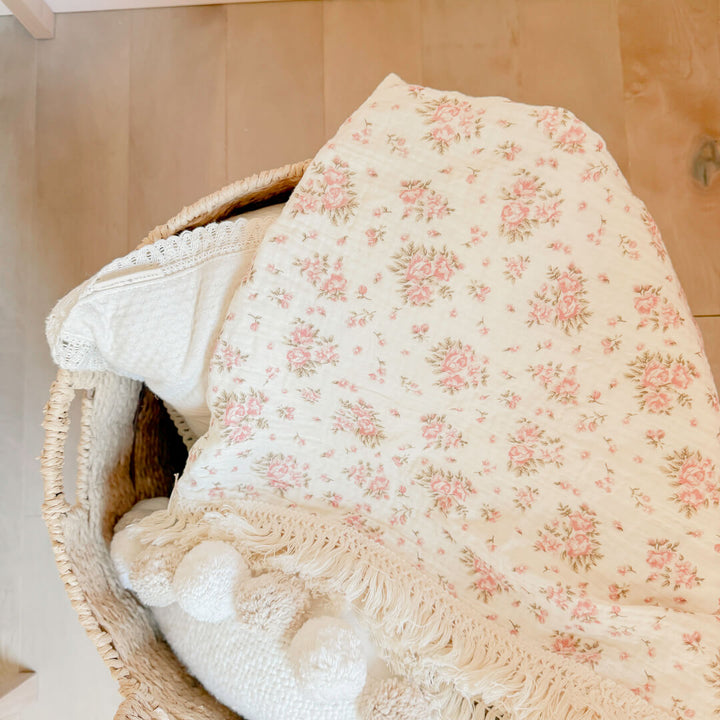 floral baby blanket with fringe edges
