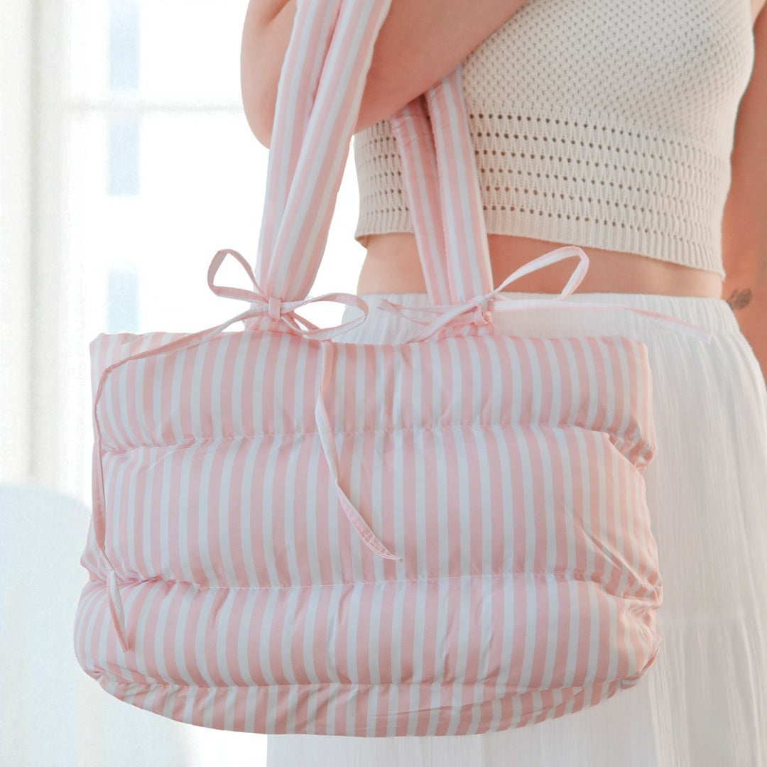 pink Quilted puffer bag with bow tie accents