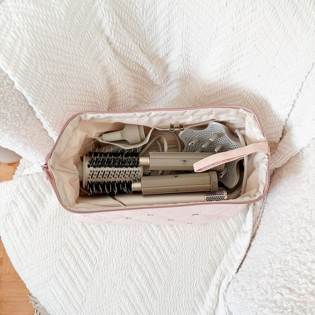 Soft quilted toiletry pouch with delicate bow details