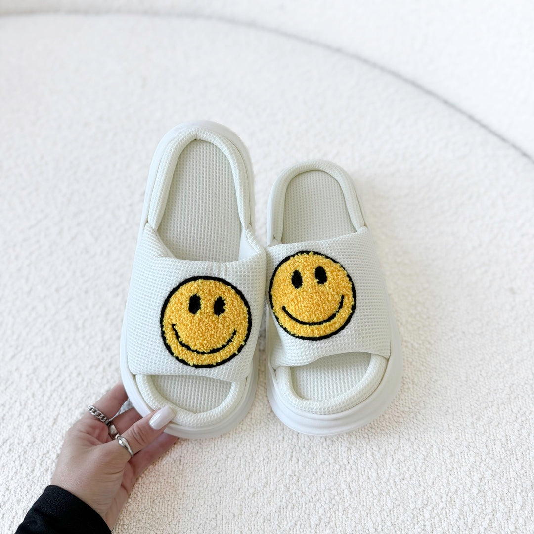 Comfortable EVA slides with yellow happy face detail