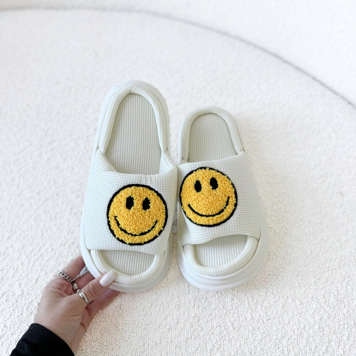 Comfortable EVA slides with yellow happy face detail