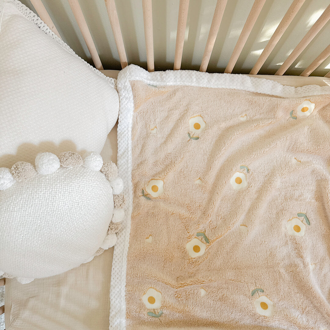 Cozy plush baby blanket with white sherpa waffle-knit trim