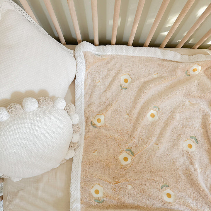Cozy plush baby blanket with white sherpa waffle-knit trim