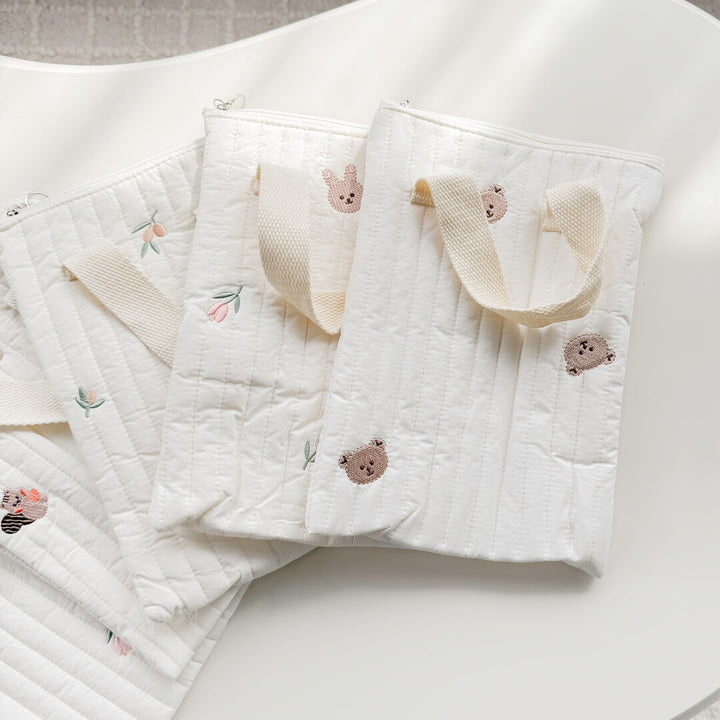 Compact baby bag with padded quilted fabric