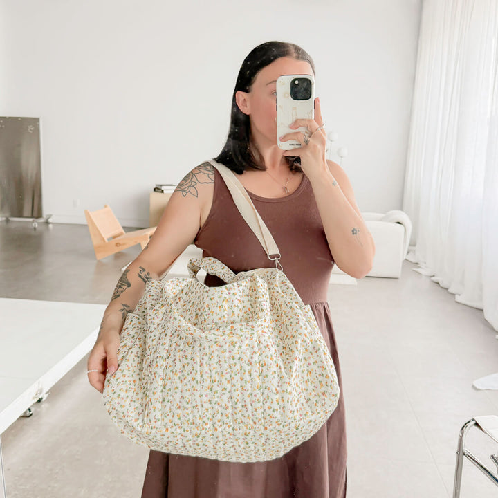 Quilted carryall bag with small orange flower print
