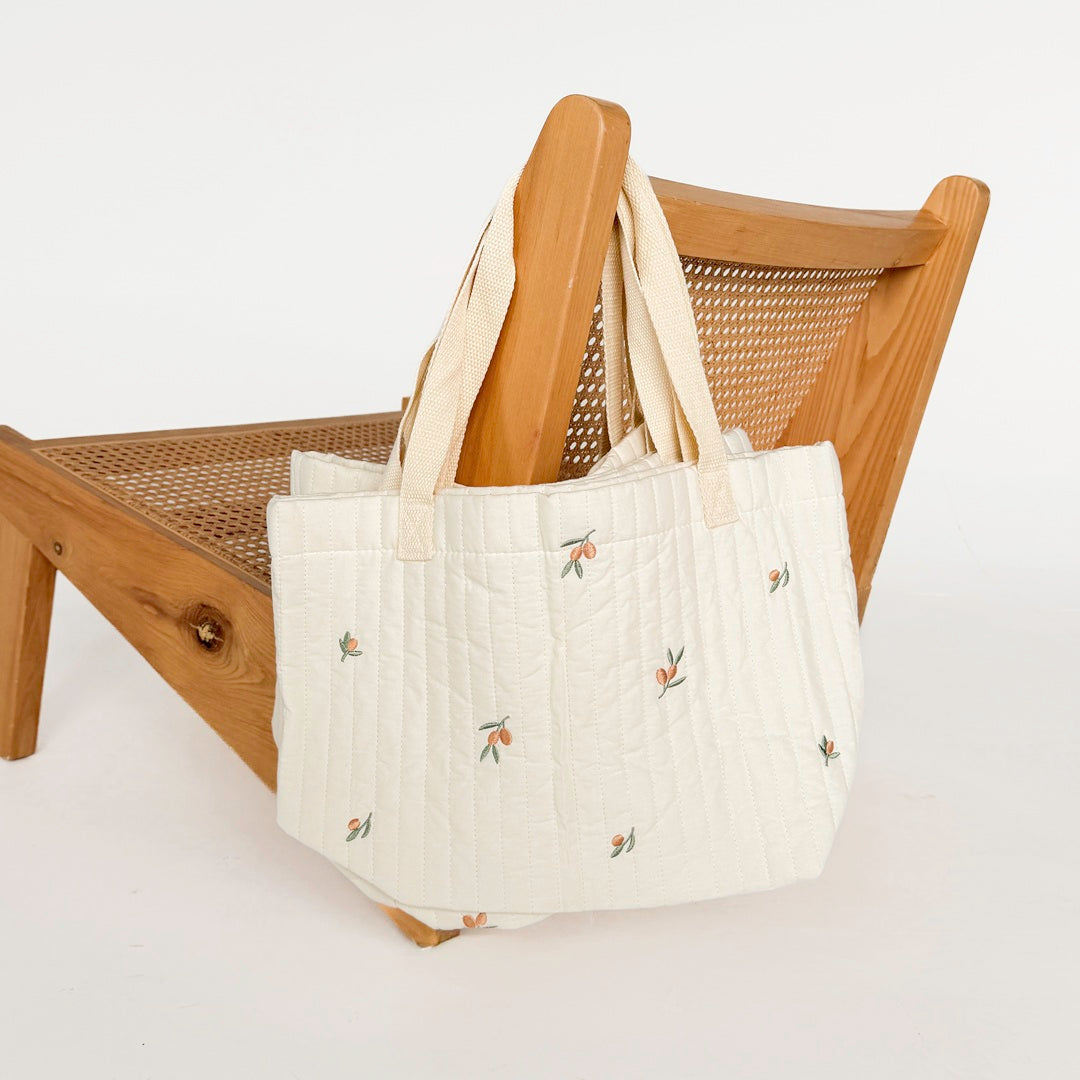 Quilted baby essentials tote bag with olive embroidery