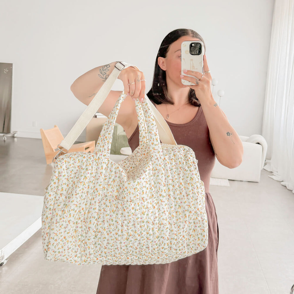 Soft floral duffle bag with zip closure