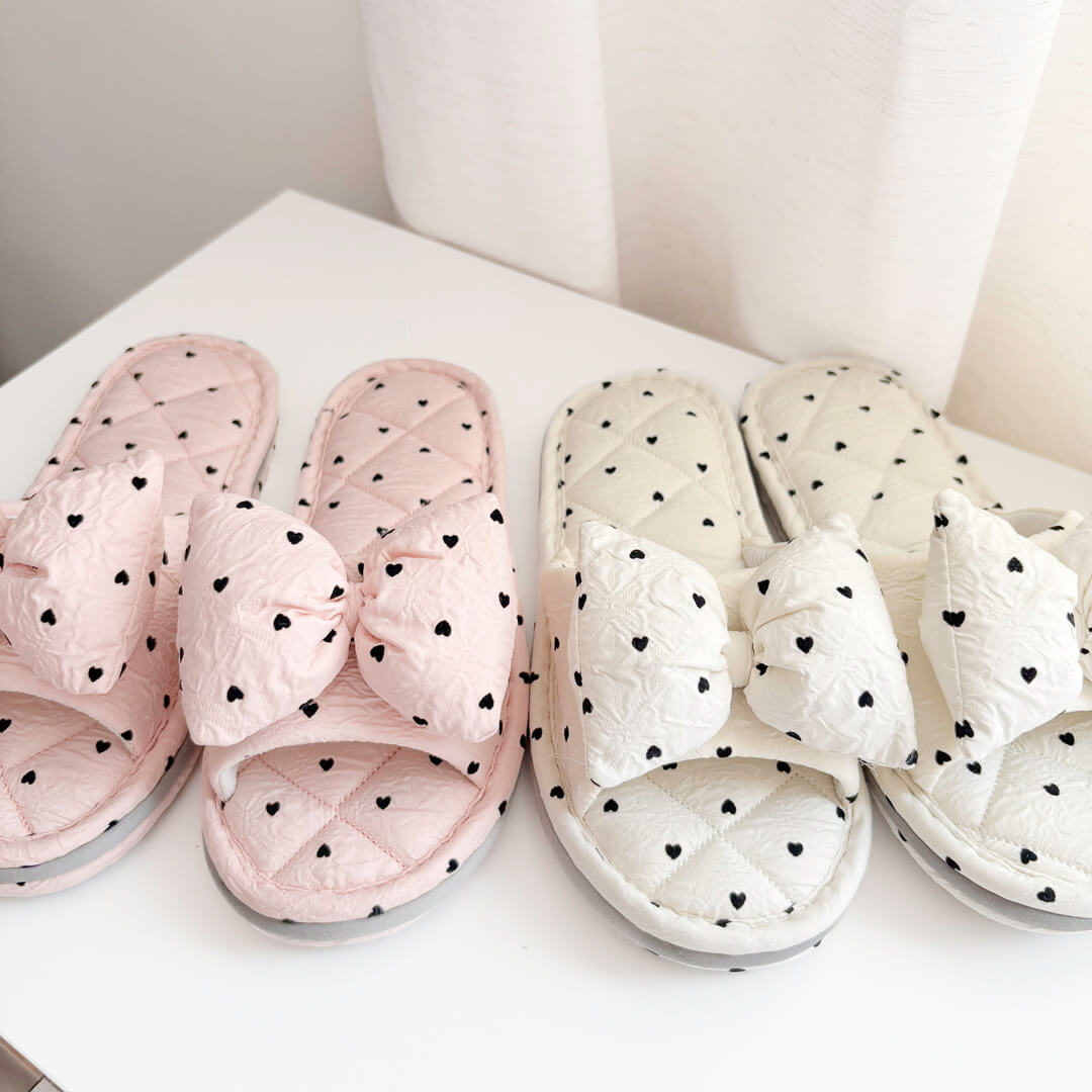 Quilted house slippers with bow and heart print design