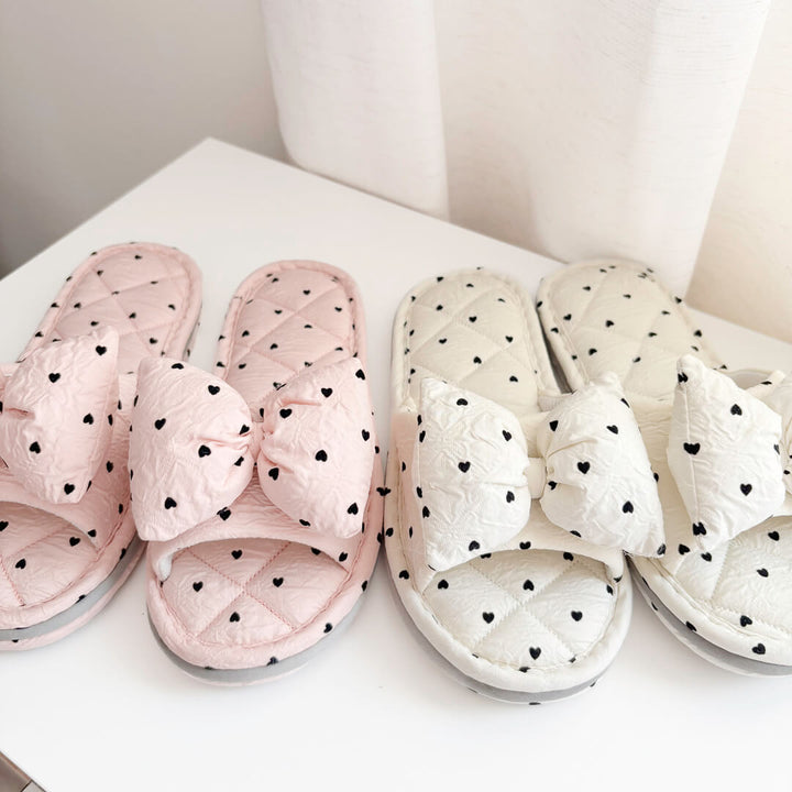 Quilted house slippers with bow and heart print design