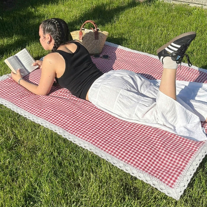 Soft cotton gingham outdoor blanket with delicate lace border detail