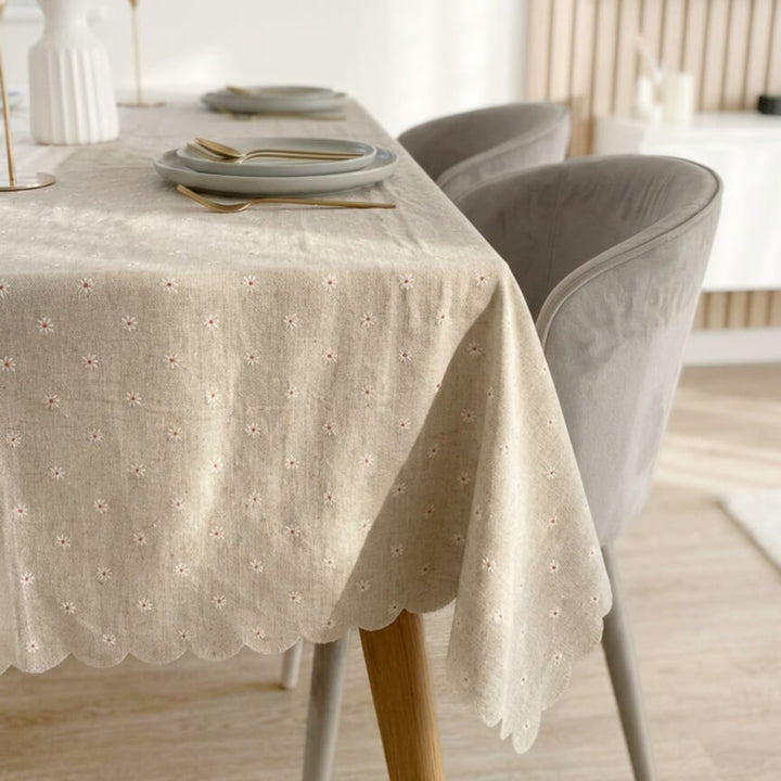Neutral floral tablecloth with embroidered daisies and soft textured finish