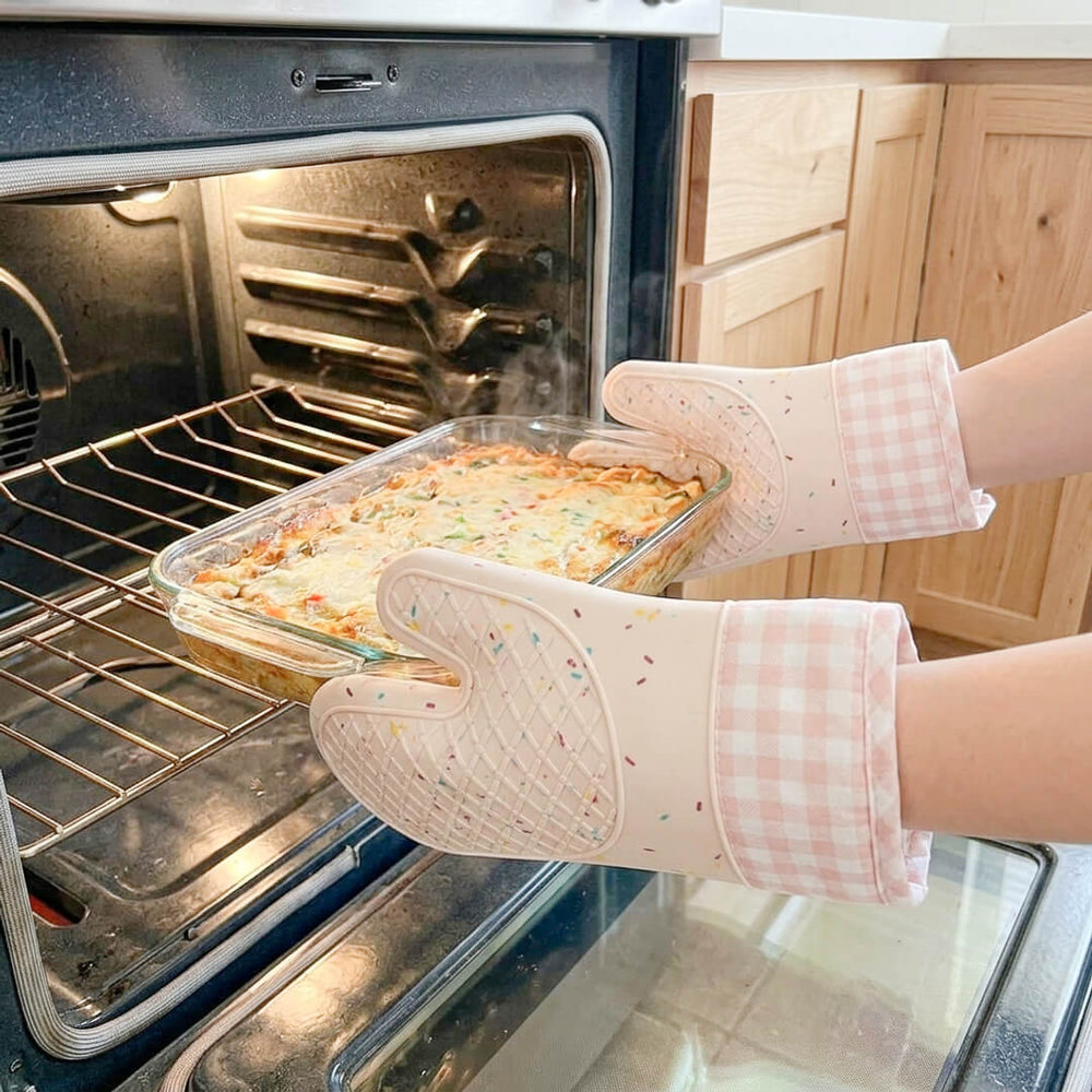 Pastel pink kitchen mitts with sprinkle confetti design