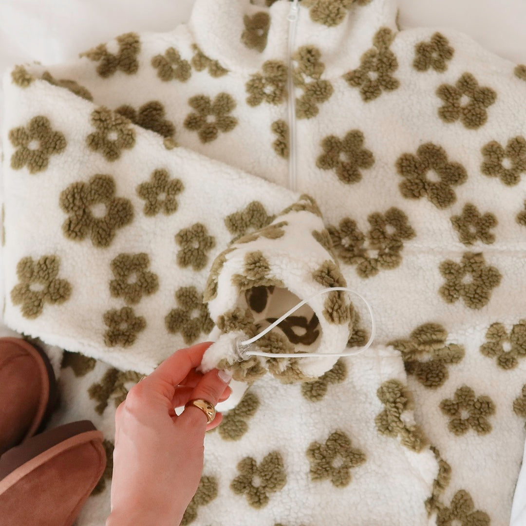 Oversized fleece pullover with plush floral detailing