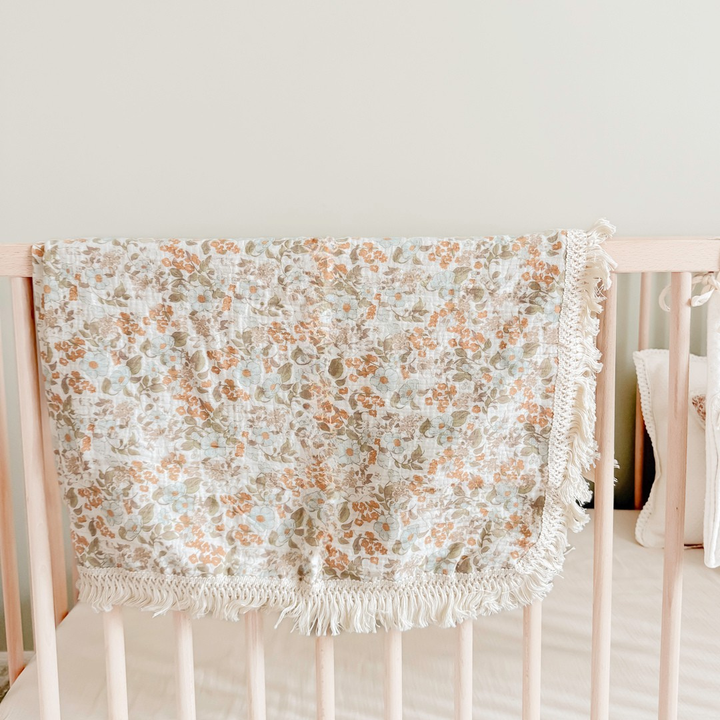Soft cotton baby blanket with delicate floral pattern