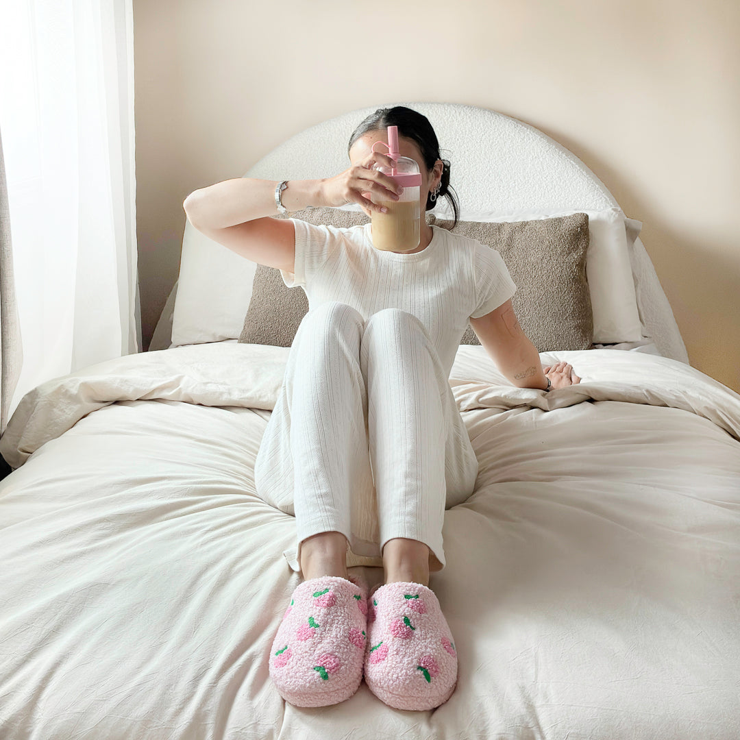 Peach patterned slippers with fluffy plush texture