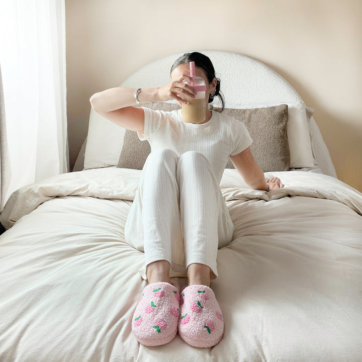 Peach patterned slippers with fluffy plush texture