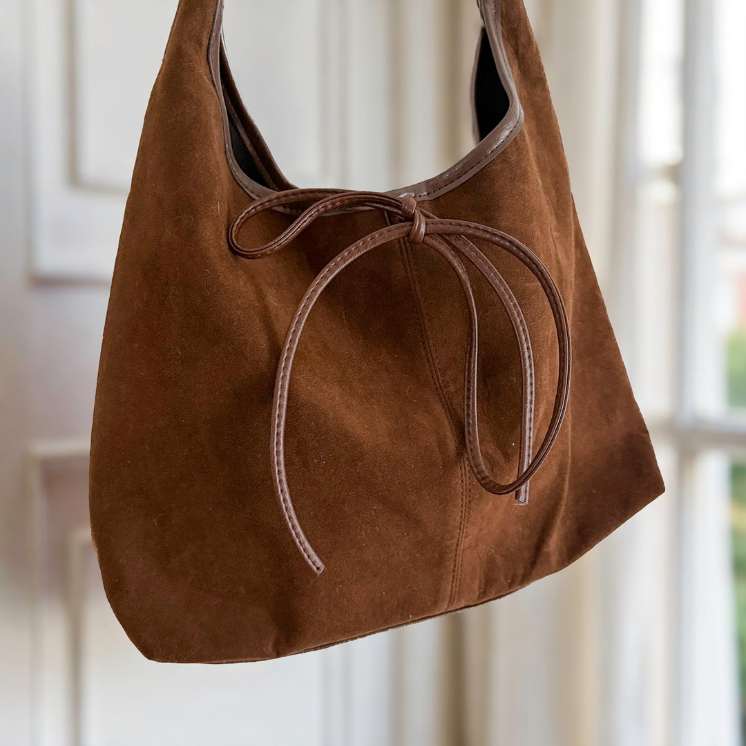 Minimalist bow shoulder bag in deep brown with roomy interior