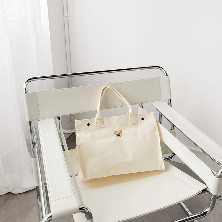 Minimalist canvas handbag with small bear