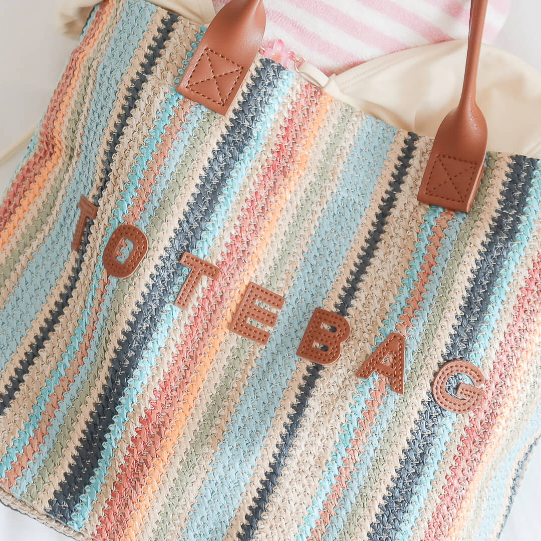 Casual tote bag with brown handles and roomy interior