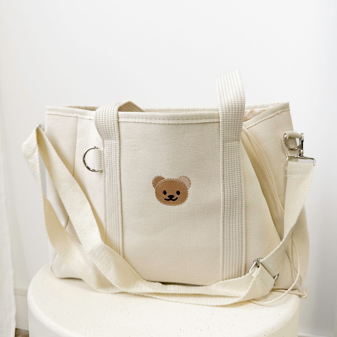 Everyday diaper tote with secure drawstring closure