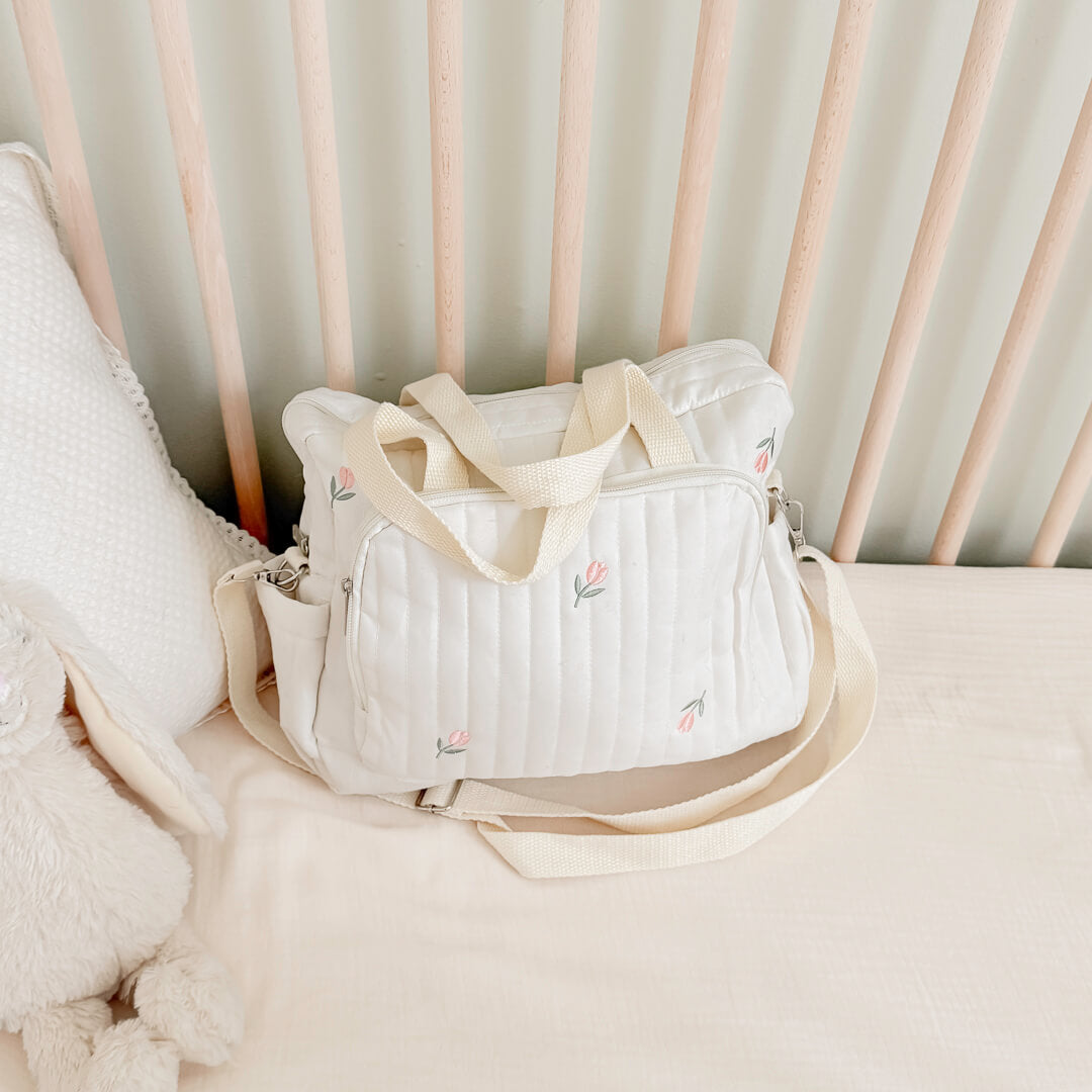 Quilted cream diaper bag with cute tulip pattern
