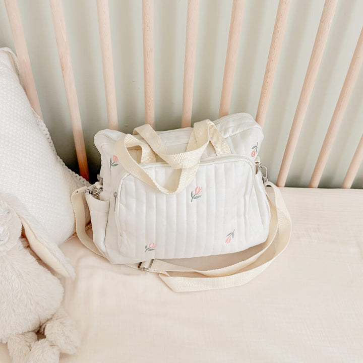 Quilted cream diaper bag with cute tulip pattern