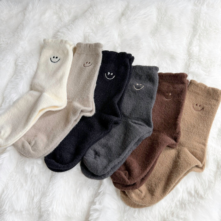 Soft plush socks in warm neutral colors for cozy days