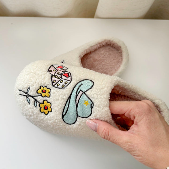 Comfortable plush slippers with embroidered boots and dice accents