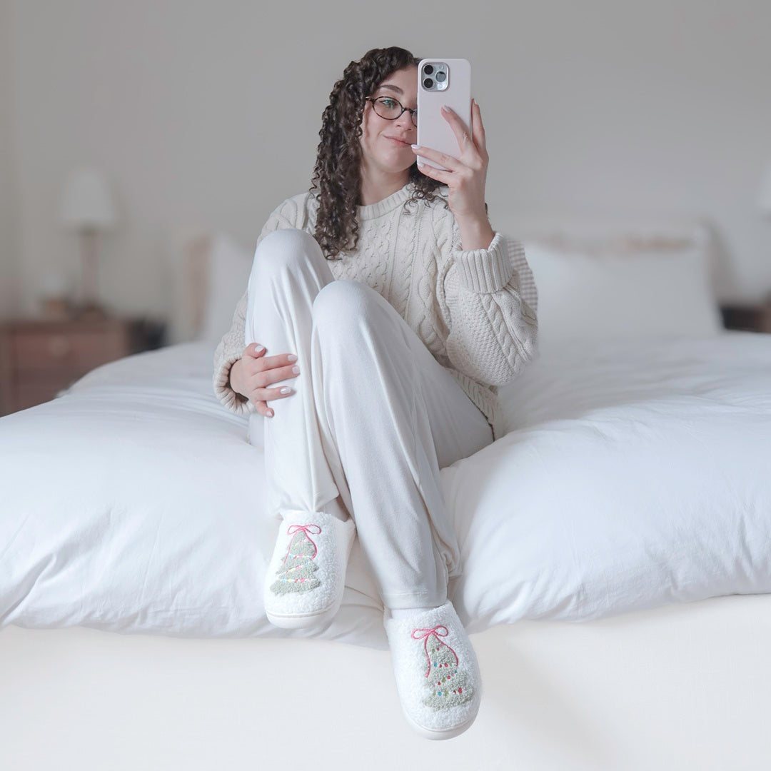 Holiday house slippers featuring a textured Christmas tree design