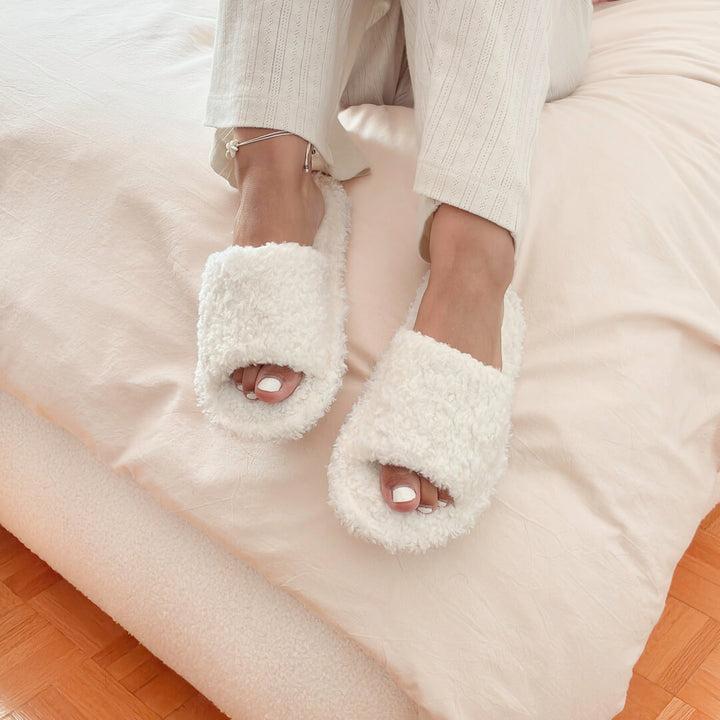 Open-toe house slippers with soft fluffy texture