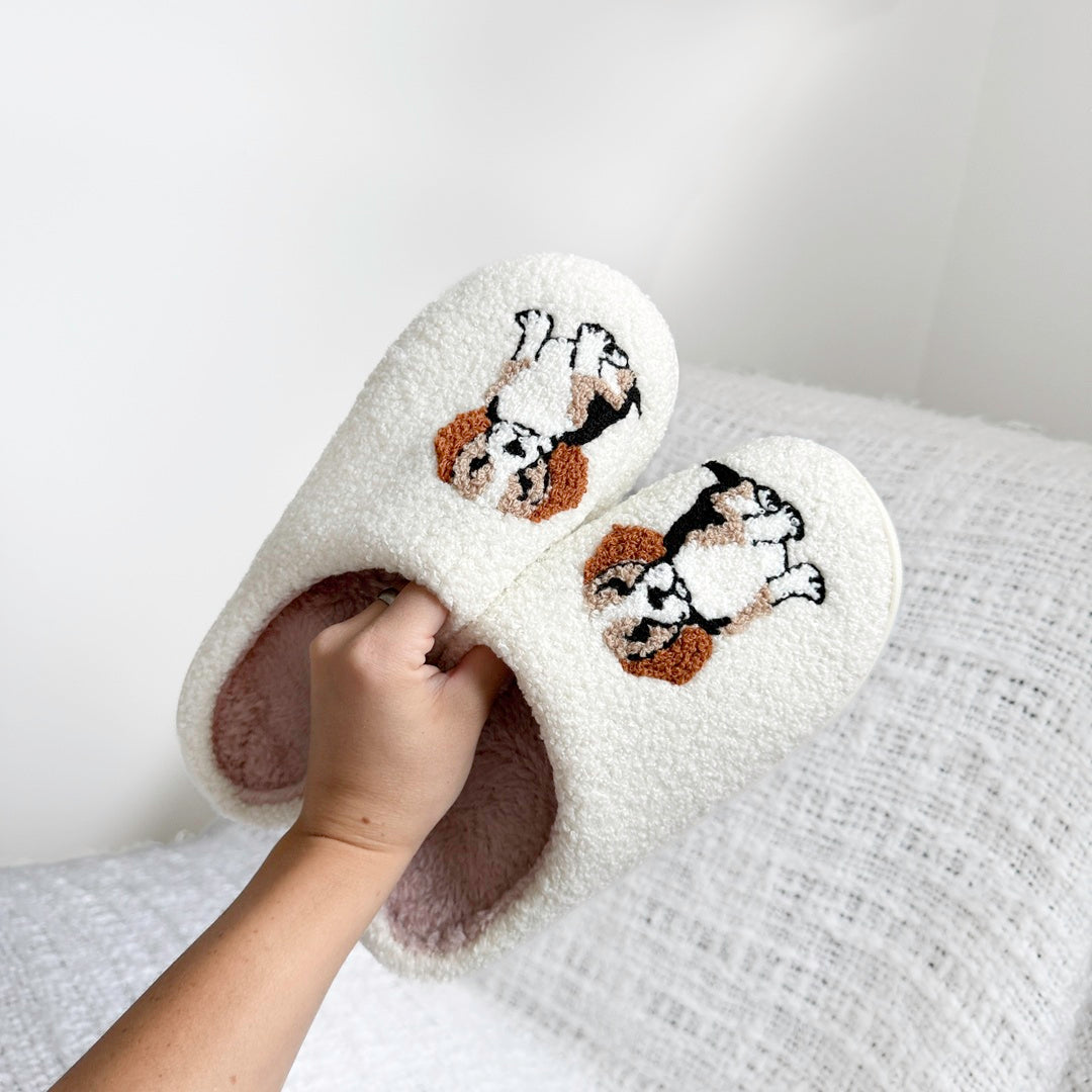 Comfortable house slippers with soft fleece texture and cute dog detail