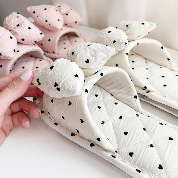 slippers with black heart pattern and bow