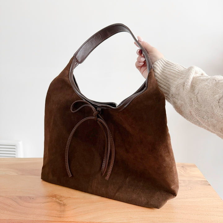 Women’s suede bow handbag with classic over shoulder strap