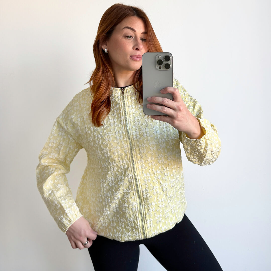 yellow jacket with white textured flower design
