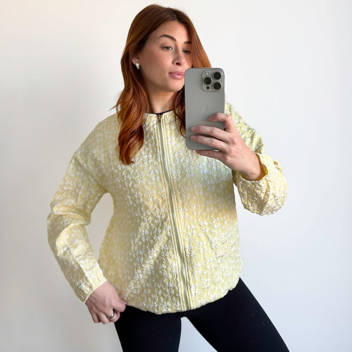 yellow jacket with white textured flower design