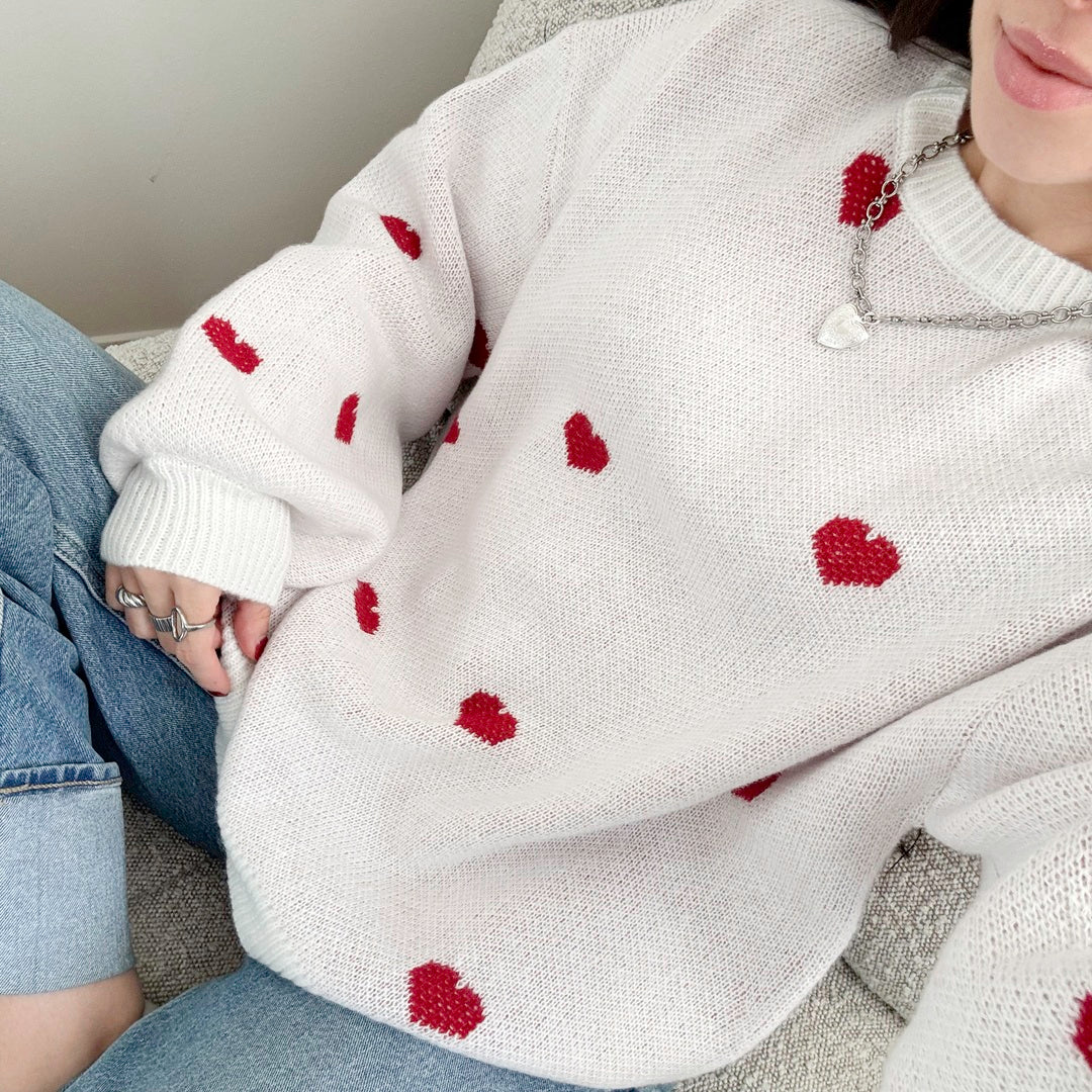 Women’s pullover sweater with red heart pattern