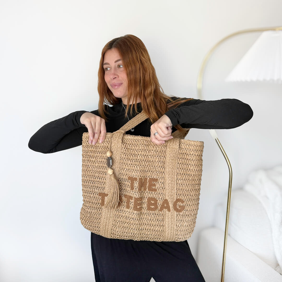 Large straw tote bag with textured front lettering