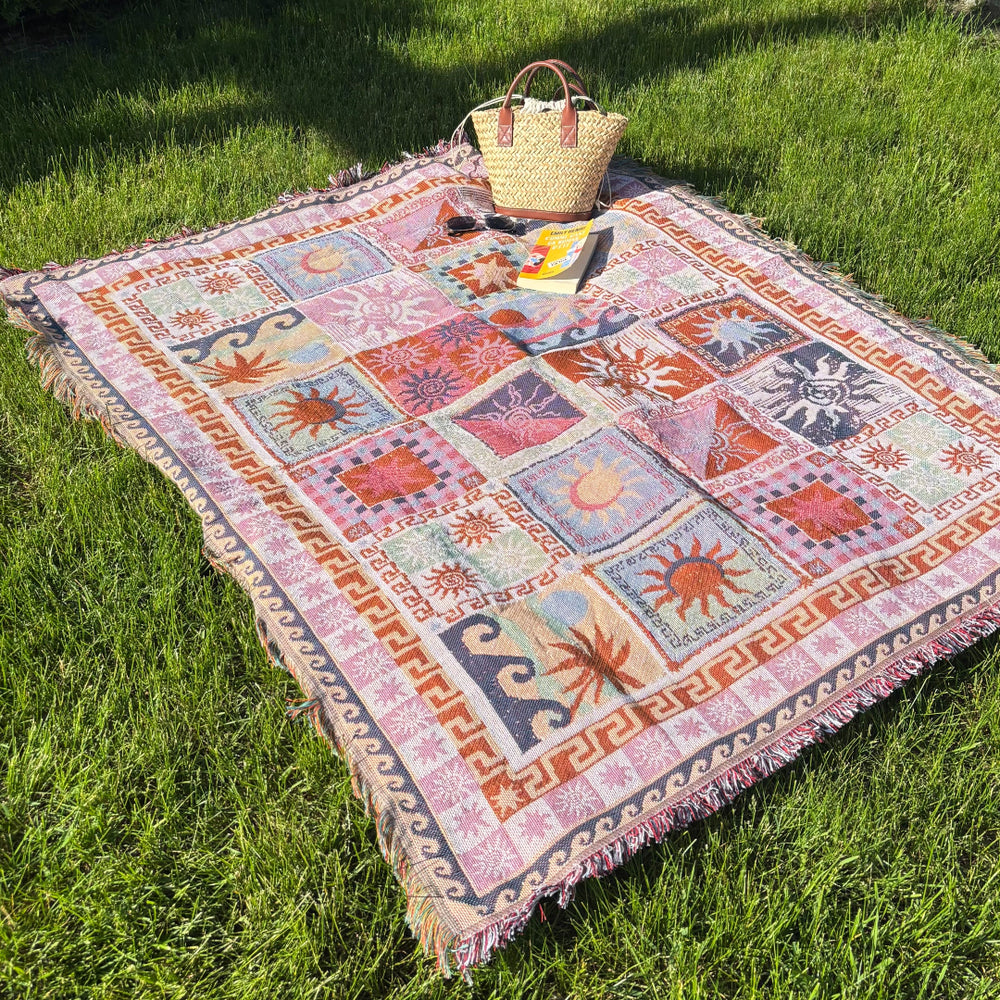 Boho tapestry picnic blanket with sun and moon motifs