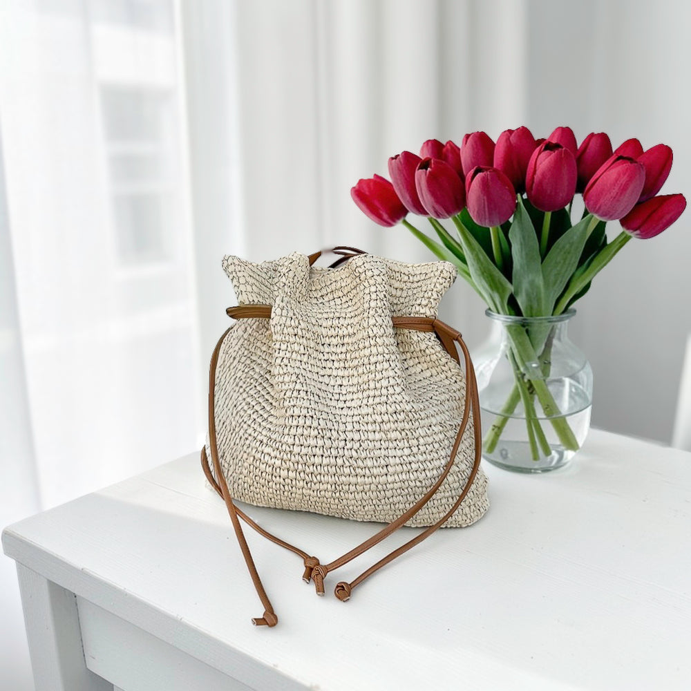 Beige straw bucket bag with drawstring closure