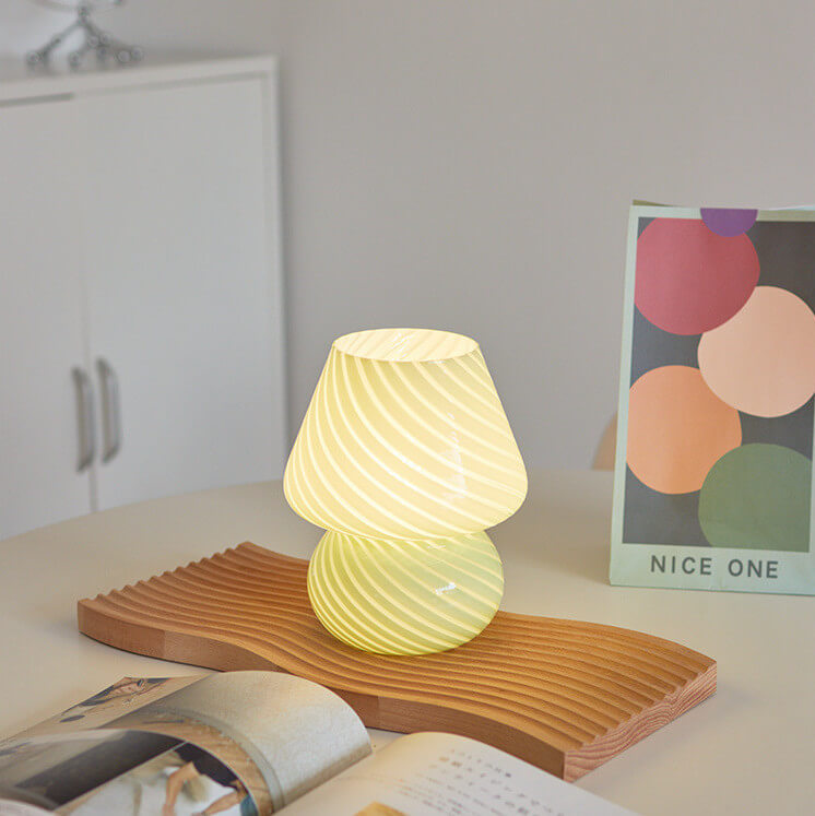 Mushroom-shaped lamp on a wooden tray.
